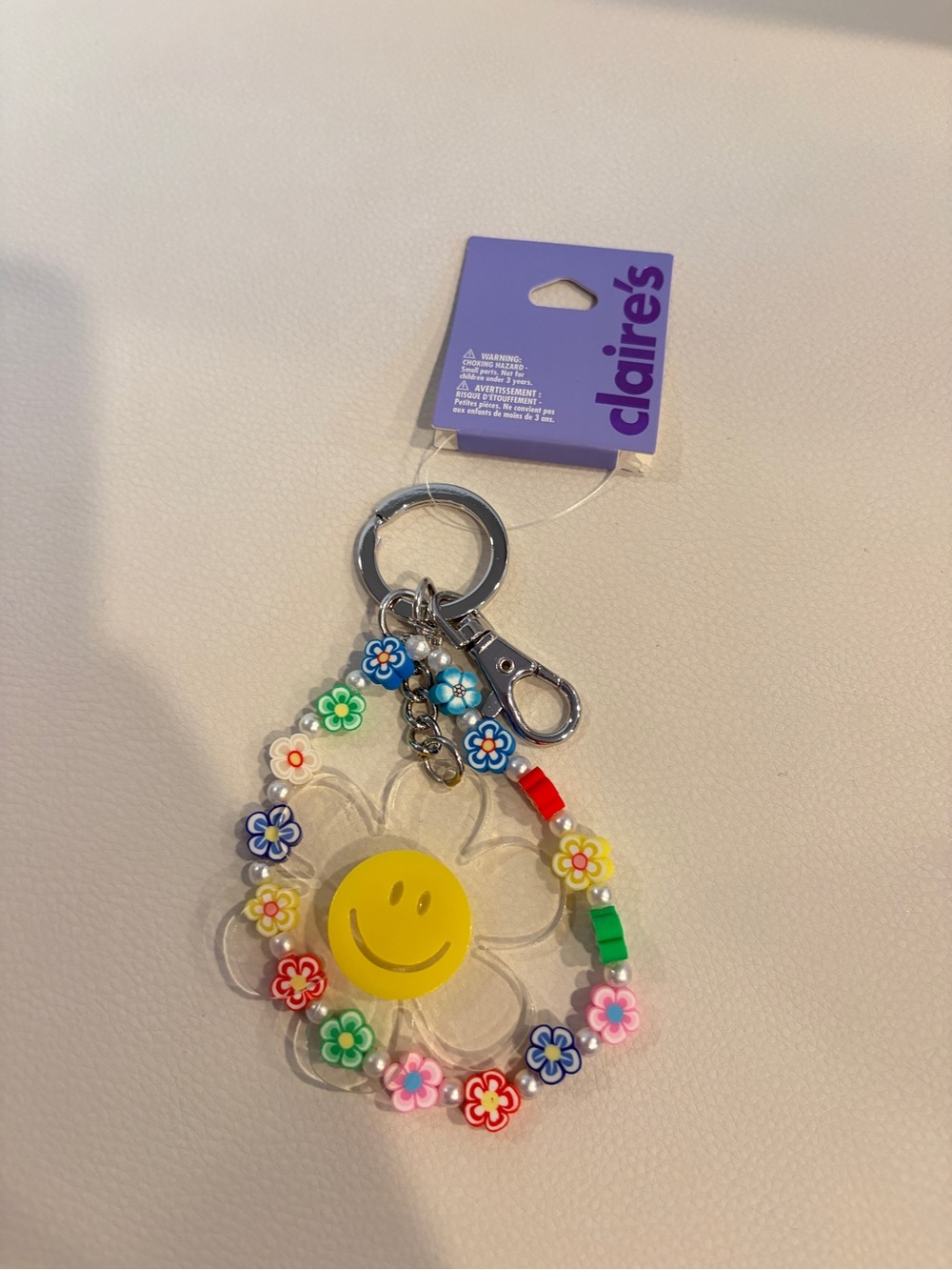 Claire’s Smiley Flower Beaded Keychain